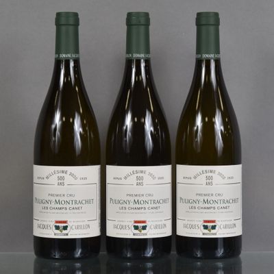 three bottles of wine are lined up on a table