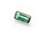 a green tourmaline gems on a white background