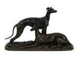une image représentant une statue d'un chien et d'un chat sur un rocher