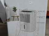 packaging of a new air purifier for sale in a store