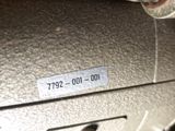 a close up of a metal object with a tag on it