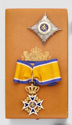 an image of a book with a medal and a star on it