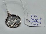 a close up of a silver coin with a tag on it