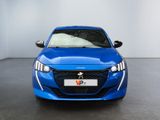 the front view of a blue car in a showroom