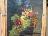 une photo d'un tableau posé sur un chevalet et représentant des fleurs