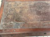 an old book sitting on top of a wooden table