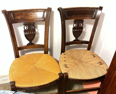 two chairs that are next to each other on the floor
