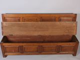 a wooden bench with a wooden seat on it