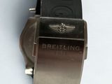 a watch that is sitting on a white surface