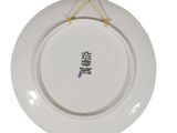 a white plate with a yellow string hanging from it