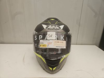 a close up of a helmet on a table with a sticker on it