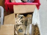 a red box filled with assorted items sitting on the floor