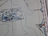 a map of the area on the table with a red marker