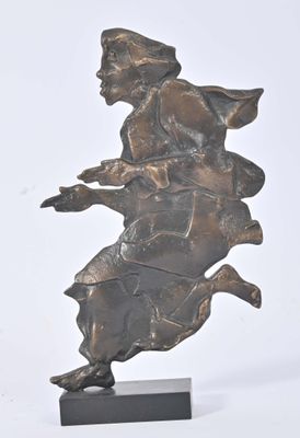 statue of a woman riding a horse on a black base