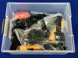 a plastic container filled with assorted items on a blue surface