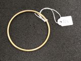 a close up of a gold ring with a price tag on it