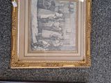 two framed pictures hanging on the wall next to each other