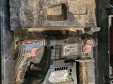 a tool box with a drill and a hammer in it
