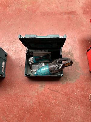 two tools that are sitting on the floor next to each other
