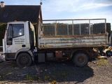 a truck that is parked in front of a house