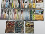 a lot of different pokemon cards on the table