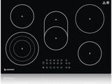 gros plan d'une cuisinière noire à quatre brûleurs