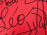 the cover of a book with a drawing of a man on a red background