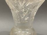 a glass vase that is sitting on a table