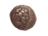 une image représentant une pièce de monnaie sur laquelle figure un visage