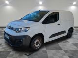 the white van is parked on a checkered floor in a room