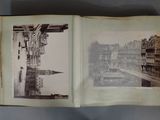 an old book with a picture of a city in it