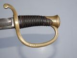 an old sword with a gold handle on a blue background