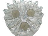 a glass plate with two candles inside of it