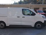 a white van that is parked in a parking lot