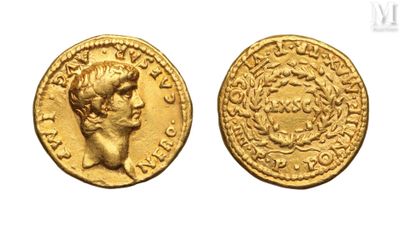 a gold coin with a head of a man on it