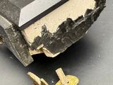 a small wooden box with a metal lid on a table