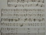 an old sheet of music with musical notes on it