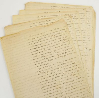 a pile of old papers sitting on top of a table