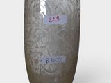 a glass vase that has a label on it