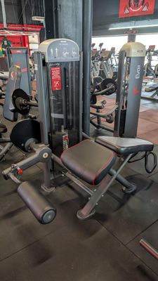 a gym with a lot of equipment in the room