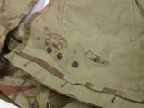 a close up of a jacket with buttons on it