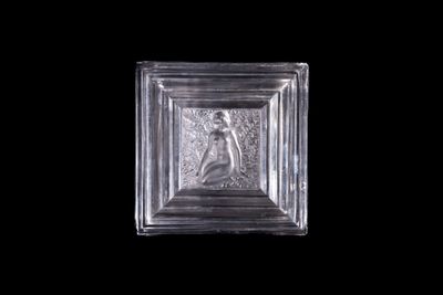 a glass block with a picture of a woman on it