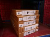 several boxes stacked on top of each other on a shelf