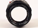 a close up of a camera lens on a white surface