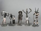 several figurines of people with hats and hats are standing in a line