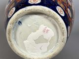 a close up of a vase on a table