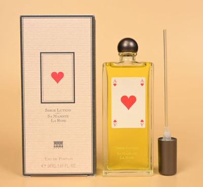 an image of a bottle of perfume sitting next to a box