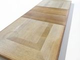a close up of a wooden cutting board on a white surface