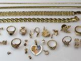 a collection of gold jewellery including rings, bracelets and rings