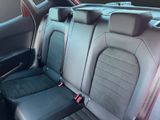 the back seats of a car are black with red trims
